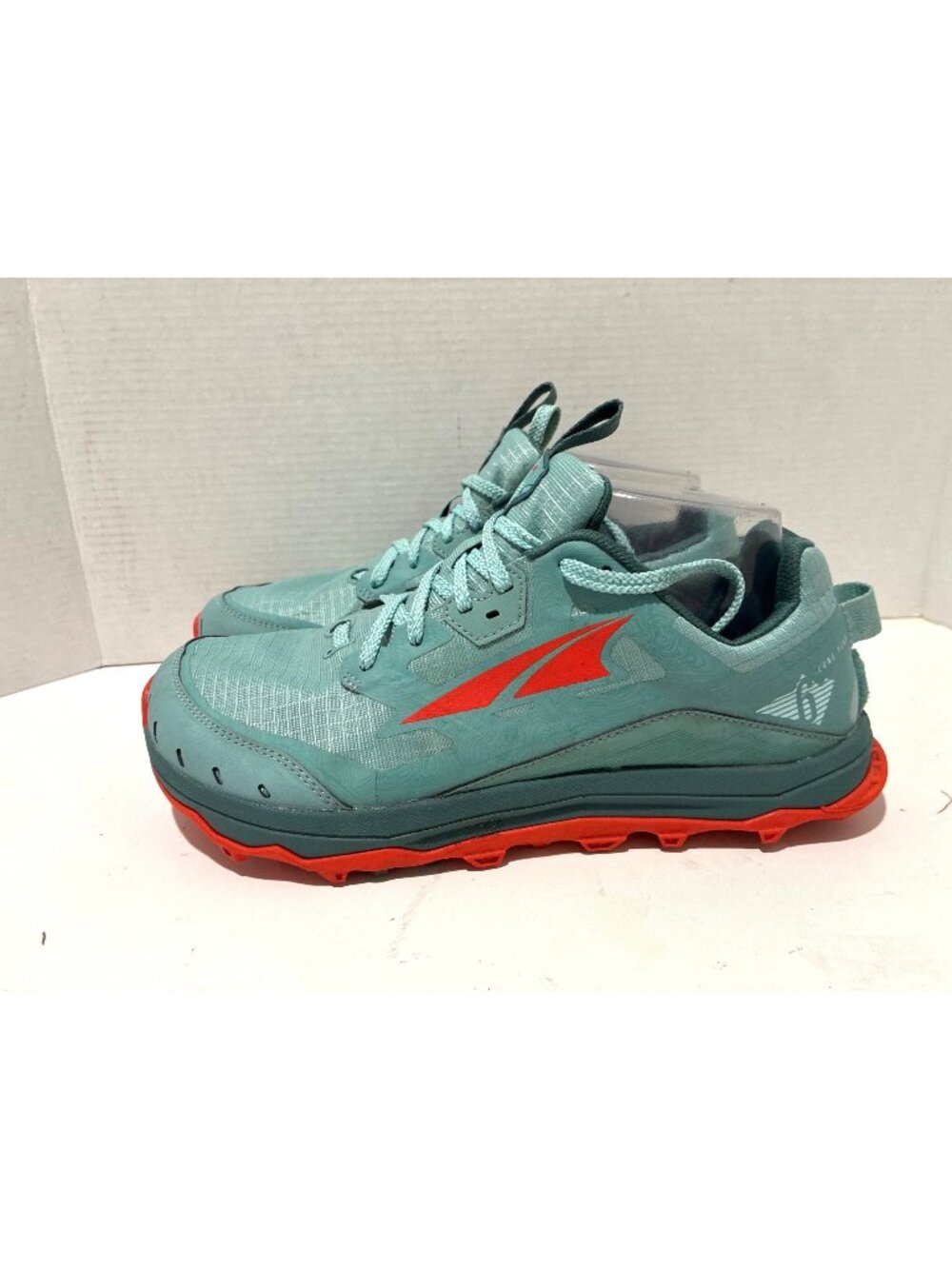 Altra women's Lone Peak 6 trail running shoes in a dusty teal colorway bold red